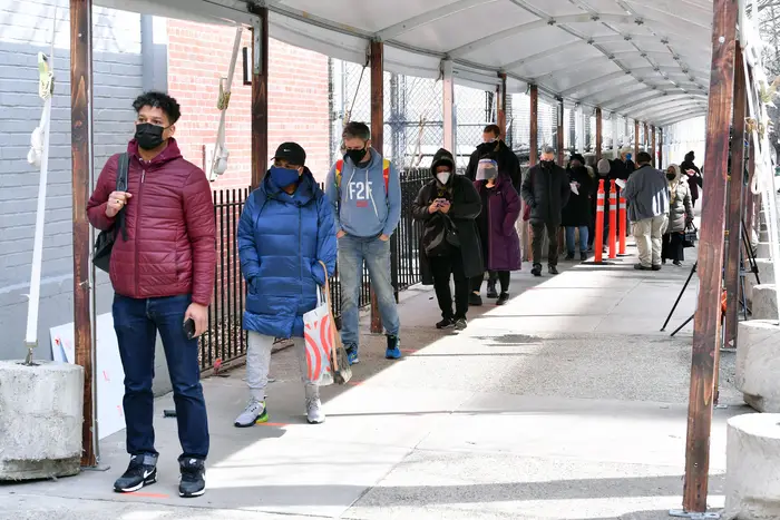 Members of the public are seen queuing outside the Medgar Evers mass vaccination site in Brooklyn on February 24th, 2021.